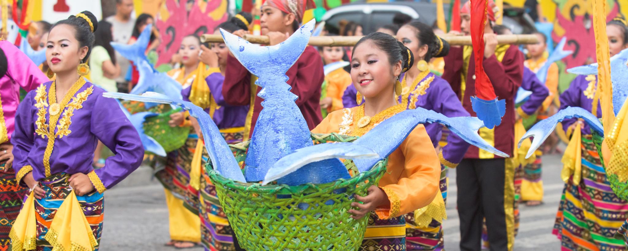 Festival with dancers in brightly coloured clothes