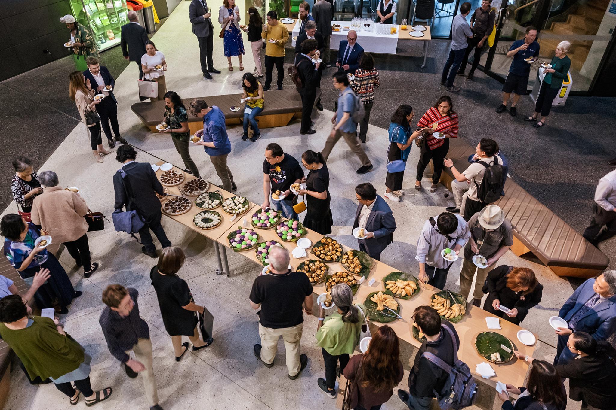 Pacific Institute Launch. top-down view of food table with guests