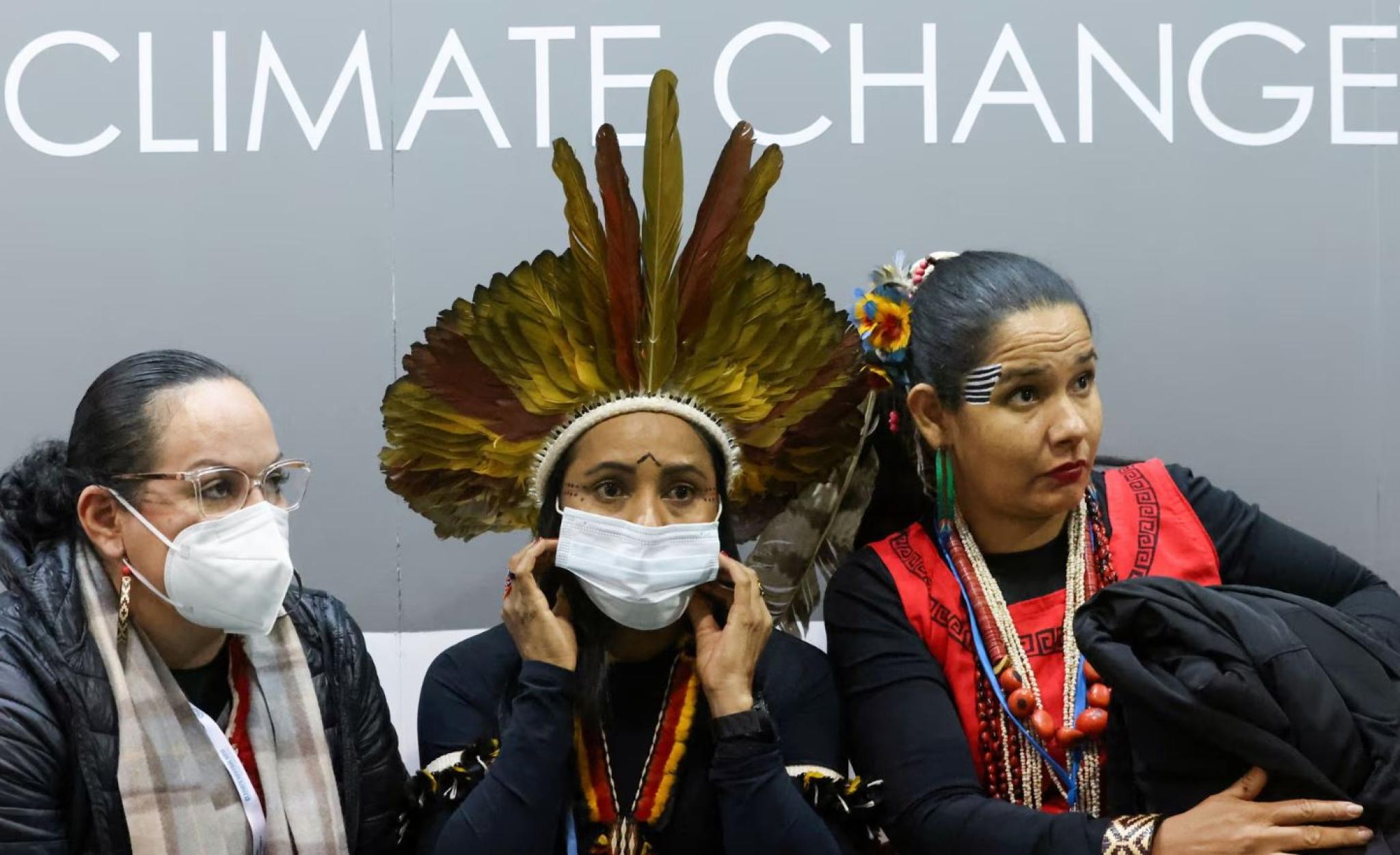 Jozilieia Daniza Jagso Inacio Jacodson Schild, Puyr dos Santos Tembe and Shirley Adilson Silva, Indigenous members of the Brazilian APIB association, at Cop26 in Glasgow, Scotland, November 2021.