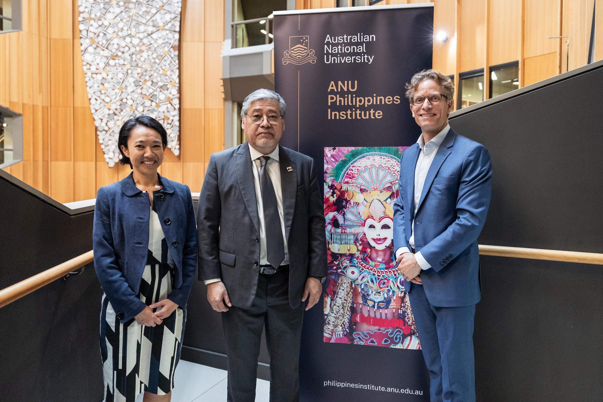 Secretary Manalo stands with ANU Philippines Institute director Björn Dressel and visiting Secretary for Southeast Asia and Global Partners in DFAT Michelle Chan.